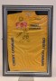 A replica 1990s Tour de France yellow jersey signed by Stephen Roche.